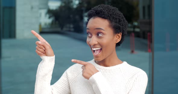 Enthusiastic Emotional Girl Woman African American Student Stands Alone Outdoors in City Against