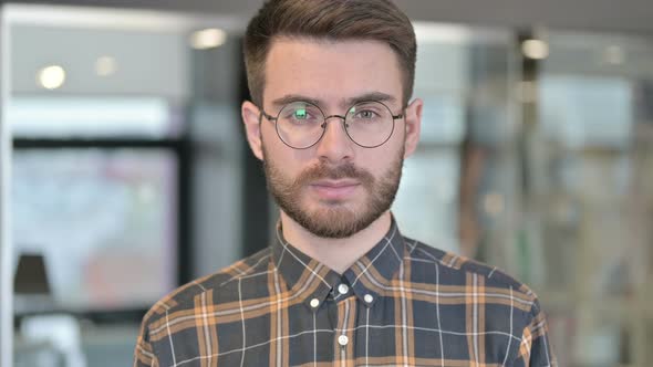 Portrait of Young Designer Looking at Camera