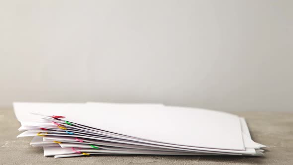 Stack overload document report paper with colorful paperclip