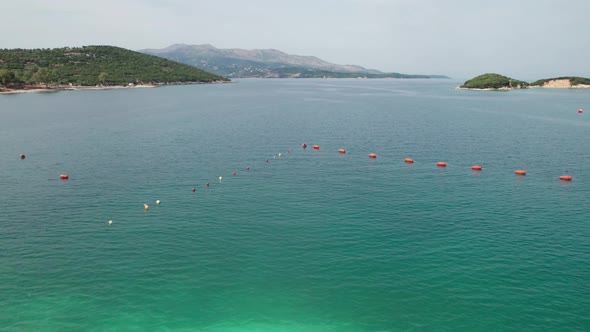 Aerial View Azure Beach with Empty Sun Loungers Balkan Coast Ionian Sea Albania