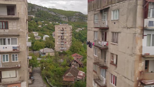 Cable Car Passing By Old Soviet Era Buildings in Chiatura Miners City in Georgia