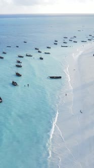 Vertical Video Boats in the Ocean Near the Coast of Zanzibar Tanzania