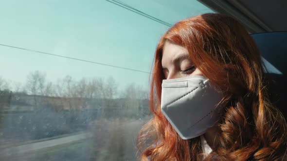 Girl with Mask Traveling on Train During Covid Period