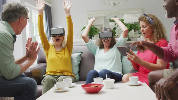 Animation of happy diverse female and male senior friends using vr headset and having fun