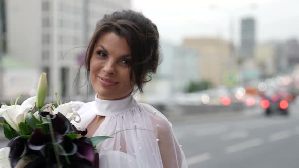 Happy Young Bride in Megapolis Portrait Shot of Beautiful Brunette in Wedding Dress