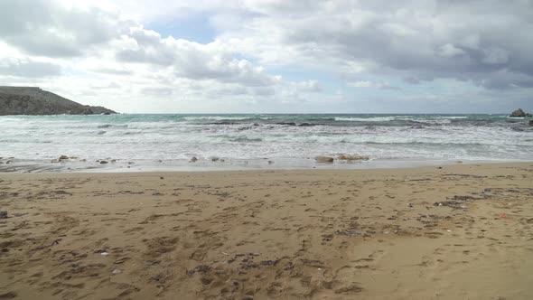 Golden Bay Beach in Winter Time with Mediterranean Sea Waving Because of Strong Wind