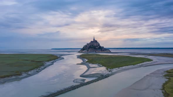 Le Mont Saint Michel France Castle in Ocean Sunrise Night to Day Hyperlapse Aerial Forward