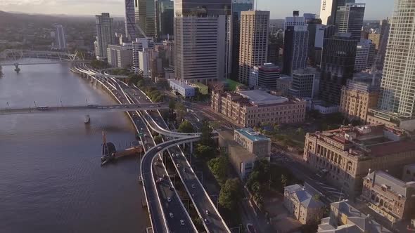 Aerial shot of motorway and buildings along Brisbane River, Queensland