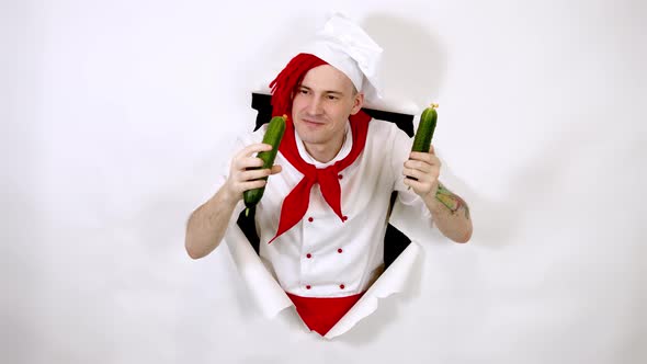 Young Insane Man Dressed As Chef with Cucumbers