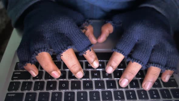 Hacker Hand Stealing Data From Laptop Top Down 