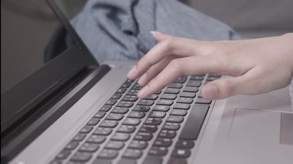 In the morning,Asian working woman on the desk with her laptop, working from home.