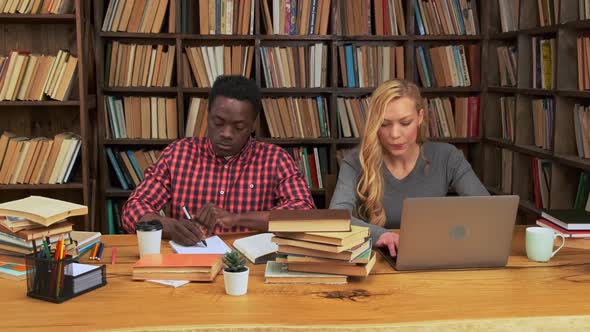 Two Multicultural Students in Public Library