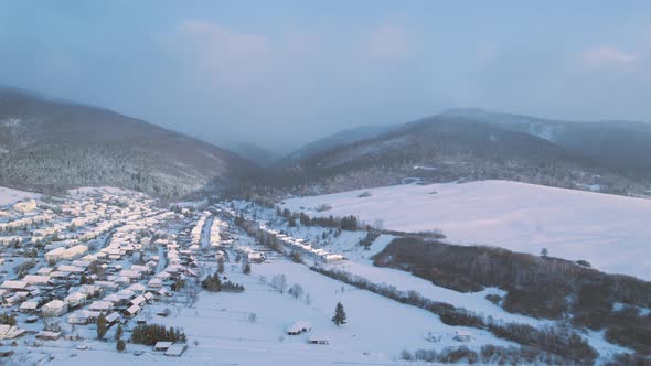 Aerial cinematic winter view of high peak mountains in Slovak tatra national park. valley covered i