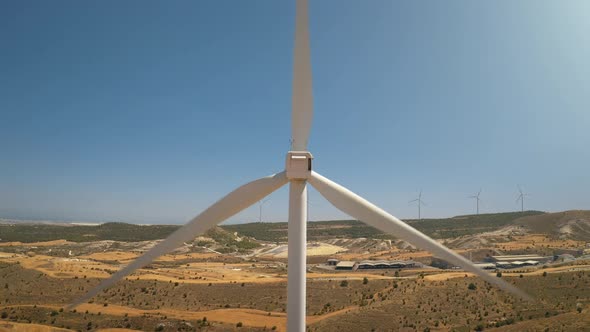 Windmill Turbine Blades Close Up Against Blue Sky