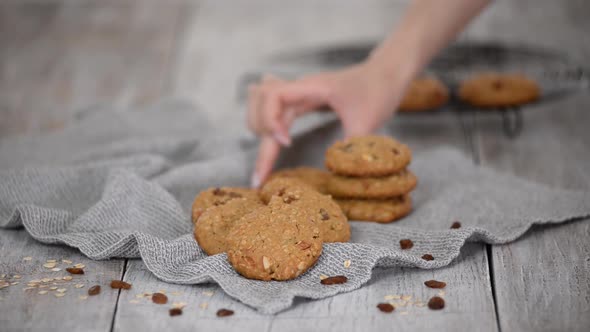 Homemade cooked oatmeal cookies with nuts raisins.