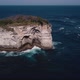 Aerial Shot of Waves Crashing on Small Tropical Rocky Island on the Coast  - VideoHive Item for Sale