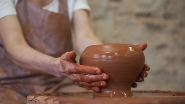 Sculptor in the Studio Makes a Clay Pot Closeup