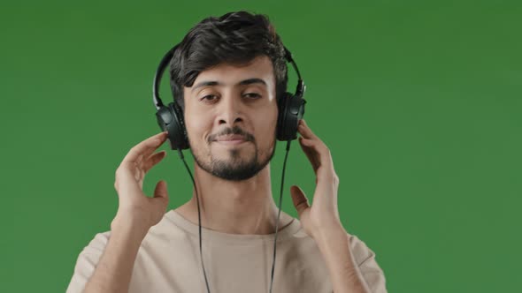 Closeup Happy Cheerful Arabic Man Listen Music Use Headphone Enjoying Song Audio Favourite Pleasant