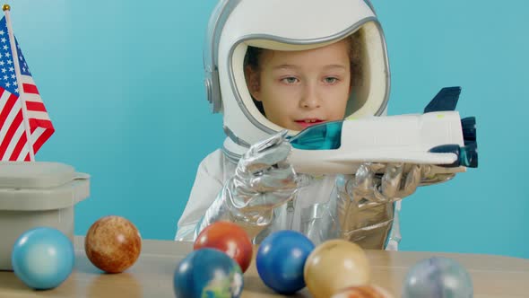 Smiling Child Launches a Space Rocket Closeup a Pilot Traveling in Space