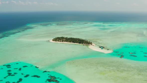 Tropical Island with Beach and Atoll with Coral Reef