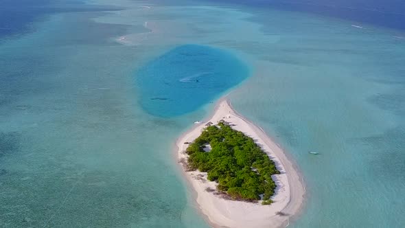 Aerial drone seascape of tropical seashore beach trip by blue sea with sand background