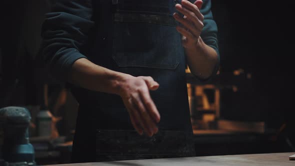 Young Unrecognizable Guy in Workshop Dark Key