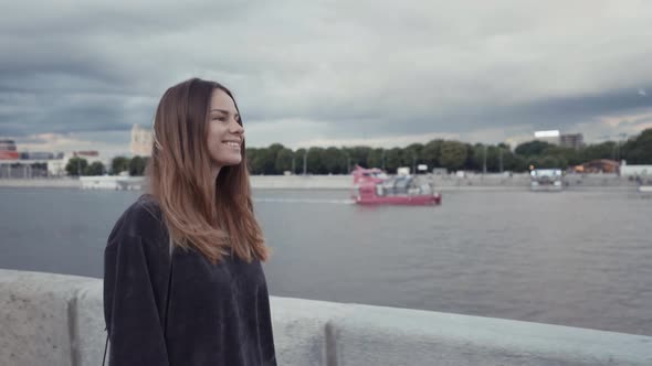 Woman is Walking on City Embankment at Summer Day Female City Dweller is Enjoying Walks Outdoors at