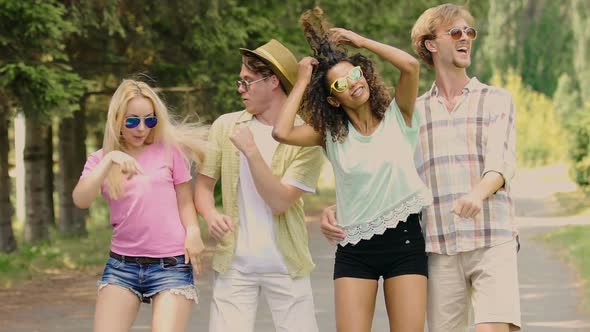 Two Attractive Couples Flirting, Dancing Together, Outdoor Party in Slow Motion