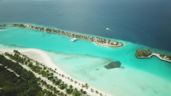 Aerial Drone View of a Beautiful Atoll or Island with a Resort in the Maldives