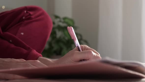 Woman Writing in Diary