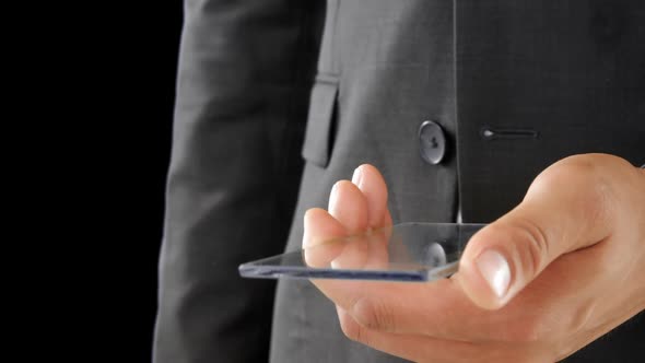 Businessman holding and touching a glass screen