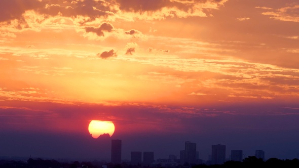 Dramatic Sunset Over City Long Lense Timelapse 4k