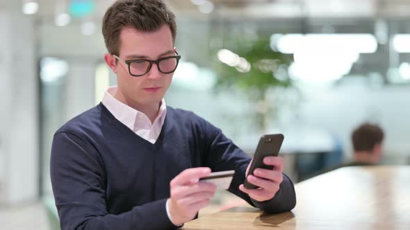 Businessman Making Successful Online Payment on Smartphone 