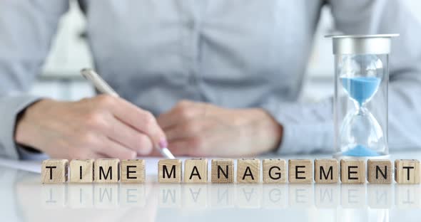 Business Woman and Hourglass Standing on Table Near Inscription Time Management Closeup  Movie