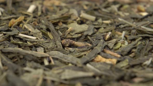 Dried hemp herbal green tea leaves on sackcloth mat