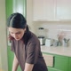 Young Caucasian Woman in Brown Tshirt Baking Cookies at Home Kitchen - VideoHive Item for Sale