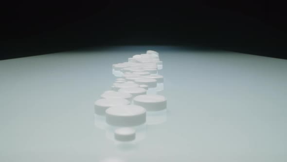 Studio Shot of White Tablets in a Row