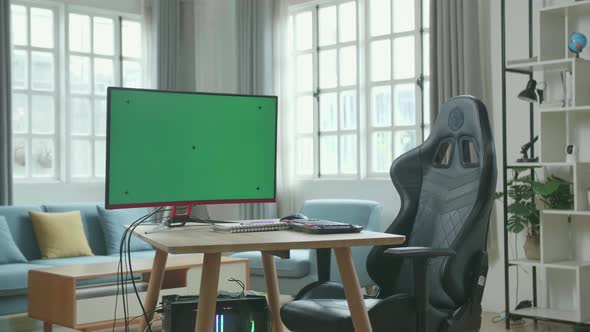 Green Screen Desktop Computer On A Table With A Chair In The Working Room At Home