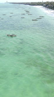 Boat Boats in the Ocean Near the Coast of Zanzibar Tanzania Slow Motion Vertical Video