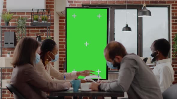 Team of Diverse Workmates Working with Vertically Green Screen