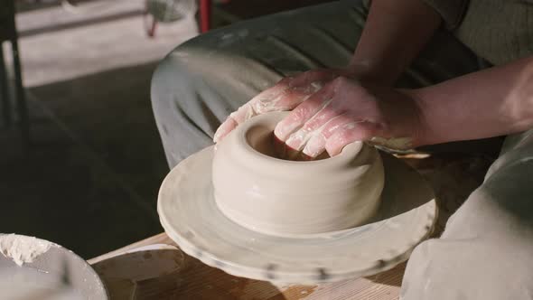 Potter Is Modeling Bowl Side of Wet Clay