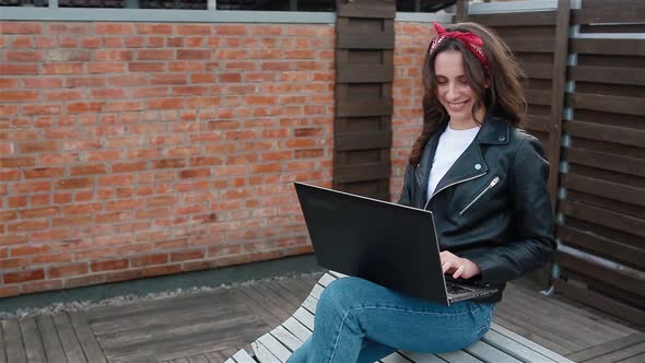 Young Female Student Working Outside