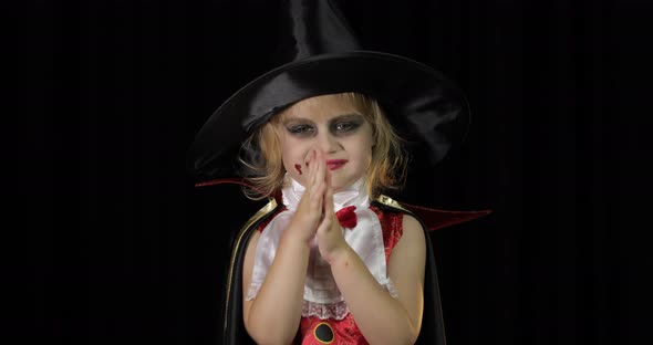 Dracula Child. Girl with Halloween Make-up. Vampire Kid with Blood on Her Face