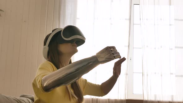 Woman with Prosthetic Arm Enjoys Virtual Reality Technology