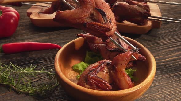 Closeup View of a Delicious Fried Quail Taken Fromm the Skewer with a Fork