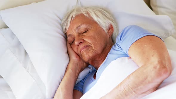 Senior woman sleeping in the bedroom