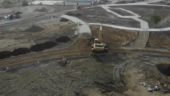 Aerial view of the excavator on the construction site.