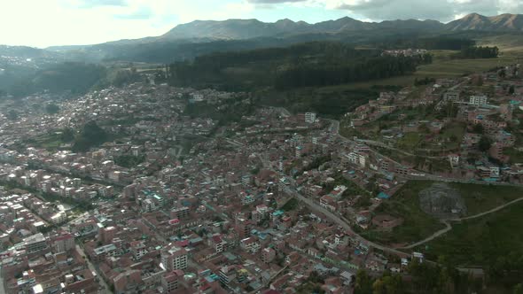 4k aerial drone footage over northern hills of Cusco near Avenida Circunvalacion in Peru during Coro