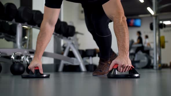 A Man with Beautiful Muscles Wrung Out From the Floor in the Gym  Slow Mo