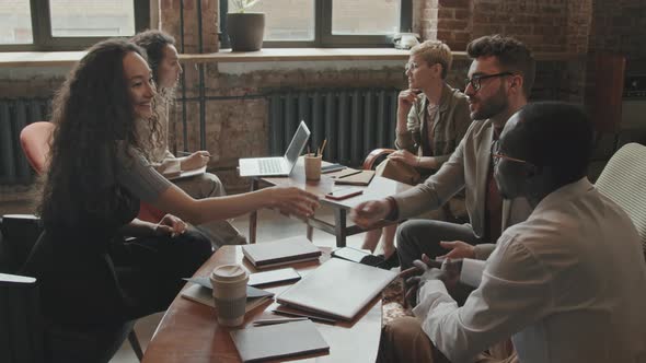 Multi-Ethnic Business Partners Making Deal and Shaking Hands